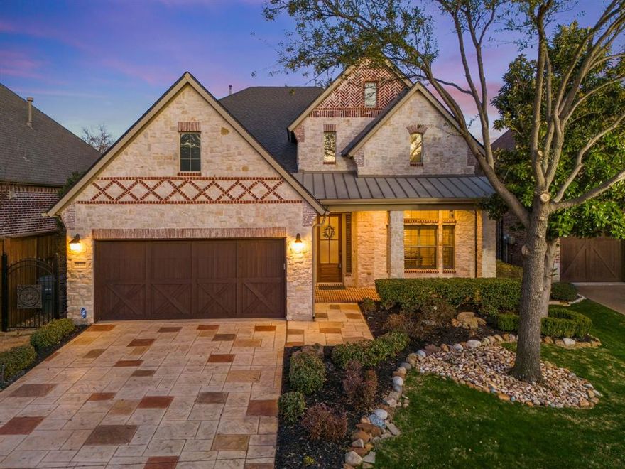 Stunning curb appeal. UPDATED 4-bed, 3.5-bath custom home in a gated community offers an exceptional blend of elegance, functionality, and privacy. Nestled on a desirable lot with no rear neighbors, the private backyard overlooks a serene greenbelt with seasonal colors —perfect for stargazing and outdoor relaxation. Established neighborhood, mature trees, and outstanding location - minutes to PGBT, DNT, & 75 for quick commutes, as well as an abundance of local shops & dining.
Designed with exquisite details, this immaculate home features a beautiful brick and stone elevation, rich hardwood floors, unique custom trim, ceiling beams, art niches, iron balusters, designer paint finishes, and wide moldings & millwork throughout. The thoughtful two-story layout provides flexibility, with a spacious master suite and a guestroom or study downstairs, while two large bedrooms, a game room, and a versatile loft are upstairs. Two potential home office spaces accommodate work-from-home needs. The oversized island kitchen is a chef’s dream, featuring custom cabinetry with ample counter space, granite countertops, a gas range, double ovens, and a breakfast bar. It opens to a grand living room with a striking fireplace and a wall of windows showcasing the backyard oasis. A formal dining area adds to the home’s entertaining appeal. The spacious primary suite offers a luxurious retreat with a spa-like en-suite bath featuring a jacuzzi tub, large walk-in shower, and easy access to the private backyard. Additional conveniences include a laundry room, a walk-in attic for abundant storage, and a two-car attached garage with a sealed floor. Outdoor living is enhanced by covered front and back porches, extended pavers, and lush landscaping. The Preston Highlands community features a quiet, safe neighborhood with a gated entry, top-rated Plano schools, and a small HOA community. This impeccably designed home is the perfect combination of modern upgrades, timeless charm, & prime location!