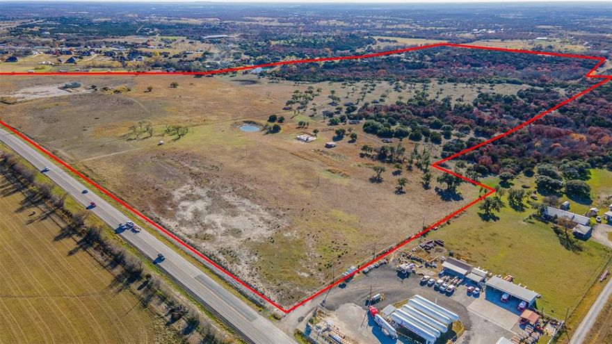 PARKER COUNTY, 5TH FASTEST GROWING COUNTY IN THE U.S.?!? WHAT COULD YOU DO WITH THIS KIND OF ROAD FRONTAGE? APPROXIMATELY 130 ACRES OF VARIED TERRAIN. NEW PERIMETER FENCING OF THE INTERIOR. CROSS FENCING OF THE FRONTAGE ROAD ACREAGE. The property is currently fenced in three parcels. Northern most fenced parcel  of road frontage is approximately 19 acres with an existing old water well, pond, hard wood trees & an incomplete steel structure on a slab. The southern most fenced parcel of road frontage is approximately 33 acres. Gas well and well sight construction visible from road. No natural water on this portion. The interior approximate 78 acres is varied terrain. Top portion has long views to the west and north and a pond(currently with water). Bottom acreage has dry creek and backs up to the Poor Farm and Stoneridge Tr. part of Mountainview Estates. Some subdividing is possible at the benefit of seller. Private property, please do not cross fence to enter. Cows on property.