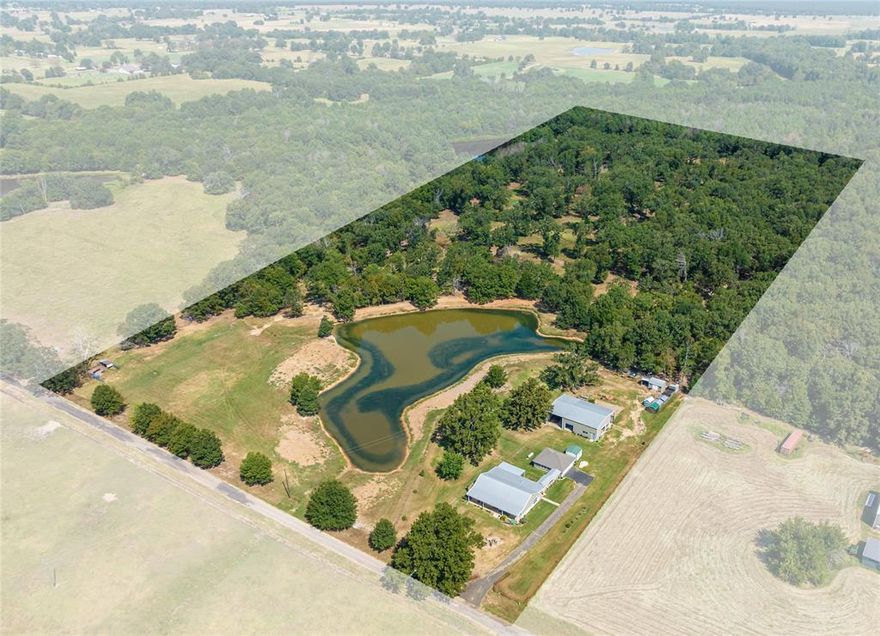 Situated on 25+ beautiful acres you will find this exquisite metal custom-built home. Capable of being used for a hobby farm, this property has it all! Main improvement is a custom-built country home with gorgeous wood floors throughout. Very clean, open living room and kitchen. Kitchen is outfitted with stainless steel appliances, granite countertops and cherry cabinets. Master bedroom has nice walk-in garden tub in bathroom. Utility and sunroom combo works perfect for the farm life with its mudroom sink and food storage. Embrace the freedom of all your hobbies with this 30x40 shop with amazing storage and cooled she shed. Wooded area has been shredded and well maintained. Small recreational pond at the back.