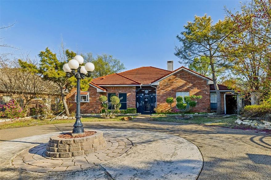 Beautiful 4 bedroom, 2.5 bath, 2 living space home featuring a private motor court with custom electric gate! Located in the highly desirable Casa View area of Dallas just South of 635 you’ll enjoy a quiet established neighborhood with access to everything Dallas has to offer. Less than 2 miles from the popular Dallas Athletic Club and just around the corner from 2 gorgeous parks. Huge centralized living room with a grandiose vaulted ceiling and focal fireplace with tile hearth & mantel. The attached sunroom makes the living room feel even grander and provides additional living space. Highly functional kitchen with lots of counter and cabinet space. The kitchen features painted cabinets, built in appliances and an attached eating area. Flex space off the front entry can be suited to your needs and used as a formal dining, office, playroom and more. Easy to maintain tile floors throughout most of the living space and real hardwoods in the rest. The primary suite boasts a vaulted tray ceiling, walk-in closet and private en suite bath with dual sinks, garden tub and separate shower. The original garage was converted to spacious game room with attached half bath and could be utilized as a living space, bedroom or work space. The garage features a double door with additional workshop space for all your crafts and projects. You won’t believe the fantastic custom outdoor space with your very own built in pond! Surrounded by a gorgeous custom board on board fence and finished with natural stone & boulders, this quiet retreat will be your favorite “room” in the house. The property is fully fenced with a custom masonry & metal fence enclosing the front yard and beautiful privacy fence in the backyard.