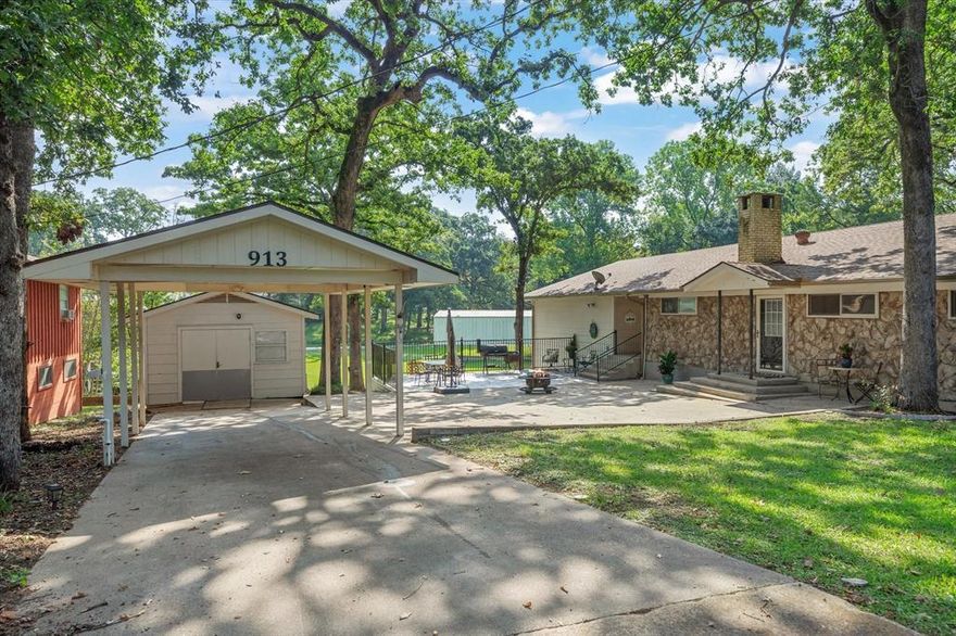 The star of this home is the location and the expansive outdoor patio and green space — made for entertaining, family gatherings, and unwinding after a day on Cedar Creek Lake. FIRE UP THE GRILL, POUR A COLD ONE, AND LET’S GET THIS PARTY STARTED!
The home is designed with fun in mind, inside and out. You’ll love the open living and dining areas, large kitchen, and cozy brick fireplace. There’s room for all your toys too — covered storage for your boat, RV, and jet skis. Plus, the community pier and boat launch are just down the street. Drop a line, take a swim, or shove off for a day on the water. Set in a beautiful, treed neighborhood, this property offers the lake lifestyle without the waterfront price tag. Perfect as a weekend getaway, full-time home, or short-term rental.