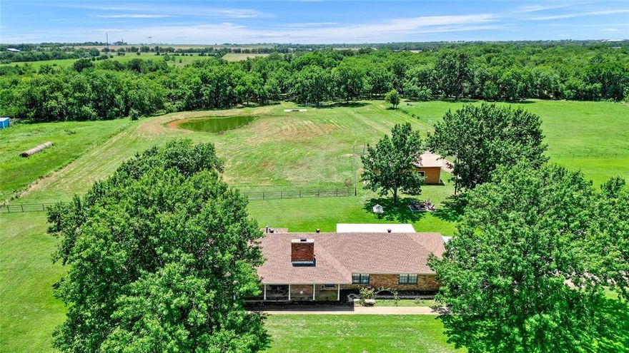 This 40-acre equestrian property is situated in the heart of Horse Country, conveniently located just east of Whitesboro along Hwy 56. The land features an array of lovely, scattered trees that enhance its charm and line the fenced perimeters. Included with this property is a spacious three-bedroom, two-bath home boasting over 2200 square feet, set back from the road to provide privacy. The generous master suite comes complete with a well-appointed ensuite bathroom. A covered patio at the rear showcases stunning views of your expansive grounds and wide-open spaces. Additionally, there’s a 20x40 barn featuring a 10-foot overhang positioned directly behind the house, while provisions for another 40x60 structure can be made to accommodate your needs and those of your animals; plus, enjoy ponds available for watering or casual fishing whenever you like.