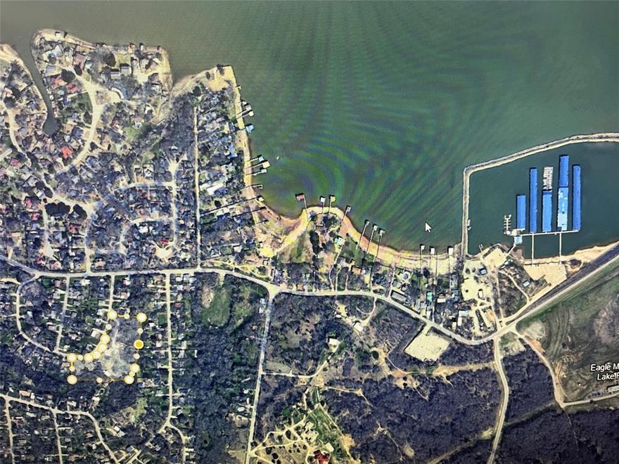 Located several blocks from Eagle Mountain Lake, this approximately 4.285-acre parcel is comprised of 7 lots to be sold together. The lots are wooded, sloping and private. There is a small house and several structures on the property. Recent development and new construction in the area. Great opportunity for builder or investor.