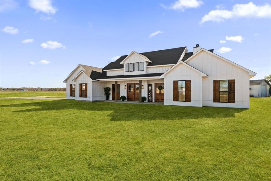 This is the kind of property people imagine when they dream about having room to breathe, room to grow, and room to truly live life on their own terms, all without giving up the conveniences they still want close by.

Set on 21 acres in Terrell, just 30 minutes from Downtown Dallas and located in Kaufman County, one of the fastest-growing counties in North Texas, this newly constructed modern farmhouse offers a rare blend of space, privacy, and accessibility. Whether you picture horses in the pasture, chickens roaming the land, a working homestead, or simply long, quiet evenings under wide Texas skies, this property supports it all and offers potential eligibility for an AG exemption.

Step inside and the craftsmanship immediately stands out. The kitchen is a true showpiece, featuring custom, hand-built cabinetry crafted by the seller’s father, adding warmth, character, and a level of authenticity that simply cannot be replicated. High-end stainless steel appliances, a commercial-grade built-in refrigerator, and a professional cooktop make the space equally suited for everyday living and entertaining. The open-concept design allows natural light to flow effortlessly through the living and dining areas, creating a home that feels both elevated and welcoming.
Despite the peaceful, private setting, you are only 9 miles from Terrell Town Center and within easy reach of shopping, dining, and daily essentials. This is one of those rare opportunities where land, lifestyle, and location truly come together, offering the freedom of acreage living with the convenience of the city just minutes away.

This is luxury living without the luxury price tag, paired with craftsmanship and character you can feel in every room.

Information deemed reliable but not guaranteed. Buyers and agents to verify all information.