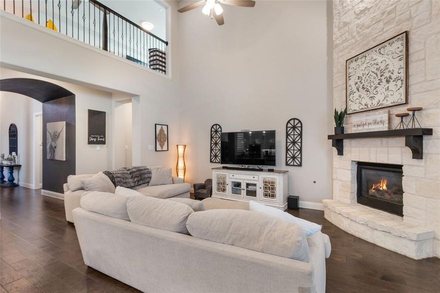 Welcome to an exceptional residence in the heart of Harvest, where refined design meets effortless living in one of the area’s most coveted communities. Thoughtfully curated for both comfort and sophistication, this home offers an elevated lifestyle with seamless indoor and outdoor living. From the moment you step inside, the open-concept floor plan creates a sense of space and flow, perfectly suited for everyday living and elegant entertaining. Designer upgrades—including plantation shutters, custom cabinetry, and bespoke mudroom storage—add both beauty and functionality throughout. The gourmet kitchen serves as the heart of the home, showcasing stainless steel appliances, generous cabinetry, an expansive island, and a walk-in pantry. Adjacent to the kitchen, the inviting breakfast nook provides a charming setting for morning coffee or relaxed meals. The living room unfolds beyond, anchored by a cozy fireplace and framed by large windows that bathe the space in natural light. A formal dining room offers an ideal backdrop for hosting memorable gatherings. The private primary suite is a serene retreat, featuring a spa-inspired ensuite bath and an oversized walk-in closet. A dedicated home office offers a quiet, sophisticated workspace ideal for today’s flexible lifestyle. Upstairs, an expansive family room provides endless possibilities for relaxation or recreation, while a dedicated media room delivers a true cinematic experience. Additional bedrooms offer comfort and versatility for family or guests alike. Outdoors, the covered patio extends the living space and overlooks a generously sized backyard—perfect for entertaining, play, or peaceful evenings under the open sky. This stunning home blends luxury, functionality, and timeless appeal in the vibrant Harvest community. Experience it for yourself—schedule a private showing today.