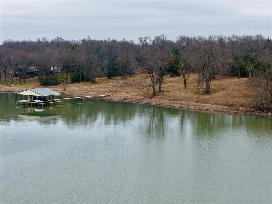 Lake Tawakoni Waterfront Retreat
Rocky Ford, Hunt County, TX

Some lakefront properties give you a view. Others offer a feeling. This one delivers both. Anchored by deep water, framed by mature pecans, and grounded in a park-like setting where privacy meets possibility.

Set within the gated Rocky Ford community just outside of Lone Oak, this full deeded acre plus approx. 1.59 SRA leaseback acres is positioned on one of the most desirable shorelines of Lake Tawakoni. Known as the Catfish Capital of Texas, Lake Tawakoni's 37,879 surface acres offer some of the best freshwater fishing in the South. This tract provides a front-row seat to it all, complete with a private two-slip dock, electricity, storage, and direct access to big open water -- appealing to both the angler and the water recreationalist alike.

This is more than a weekend escape. It's a rare opportunity to build a lasting legacy just 67 miles from Dallas and 69 from Frisco -- close enough for convenience, yet far enough for peace.

Property Highlights
Location: Rocky Ford community, Hunt County -- 5.4 mi to Lone Oak, 40 mi to Rockwall, 67 mi to Dallas, 69 mi to Frisco

Water: Approx. 238 ft of private shoreline, two-slip covered dock with electricity and storage, SRA leaseback for additional shoreline access

Land: 1 deeded acre plus approx. 1.59 leaseback acres, towering pecan, red oak, blackjack and post oak trees, Lamar loam soils, 20 ft elevation change, excellent build sites

Utilities: Electric and water available. Annual taxes: 4,194.24 U.S. dollars

Wildlife: Whitetail deer, waterfowl, squirrels, rabbits, elite freshwater fishing for catfish, hybrid bass, crappie, and more

Community: Gated entry, pool, tennis and basketball courts, covered casita with grill and fireplace, adjacent 10-acre greenbelt with walking trails

Boundaries shown in aerial photos and mapping are approximate.
