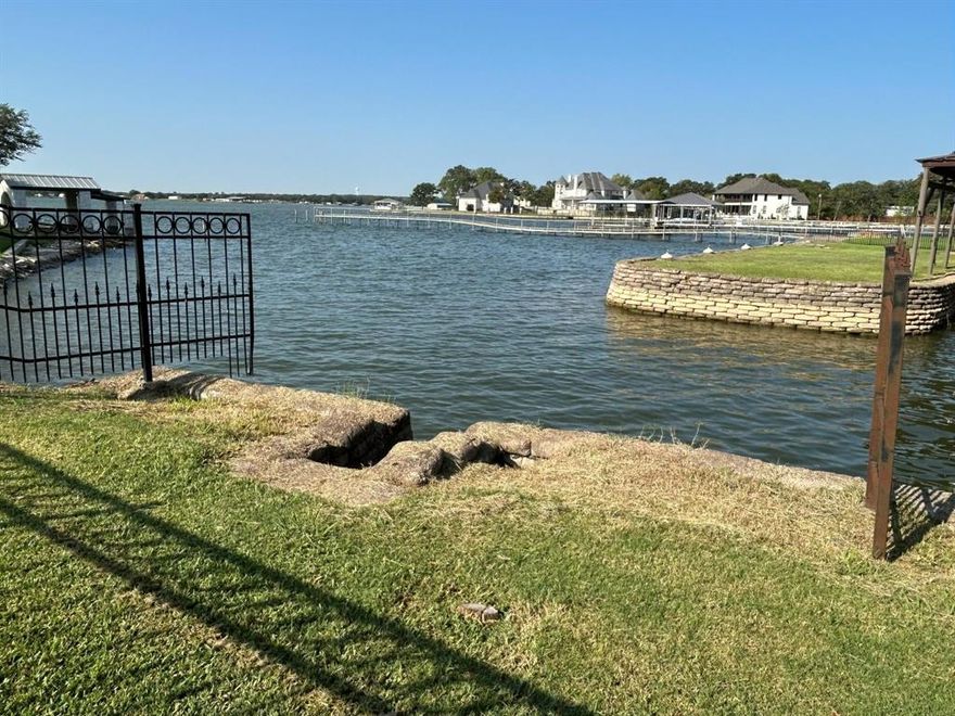 One-of-a-Kind Opportunity to Own a Piece of Eagle Mountain Lake. Nestled among majestic oak trees, this charming 3-bedroom, 2-bath single-story home offers a warm and inviting atmosphere. With 1,452 sq. ft. of comfortable living space on a 0.374-acre lot, it’s the perfect blend of nature and comfort.
Enjoy solid wood floors in select areas and expansive lake views that truly must be seen in person—photos don’t do them justice. A separate lakefront section just across the street (approximately 18 ft.) provides a serene spot to relax and take in the water with family as well as fish, swim, picnic. 
Experience the freedom of no HOA fees, no city taxes, and complete independence with your own well and septic system. This is a rare, one-of-a-kind chance to own a piece of Eagle Mountain Lake and enjoy lakeside living on your own terms.