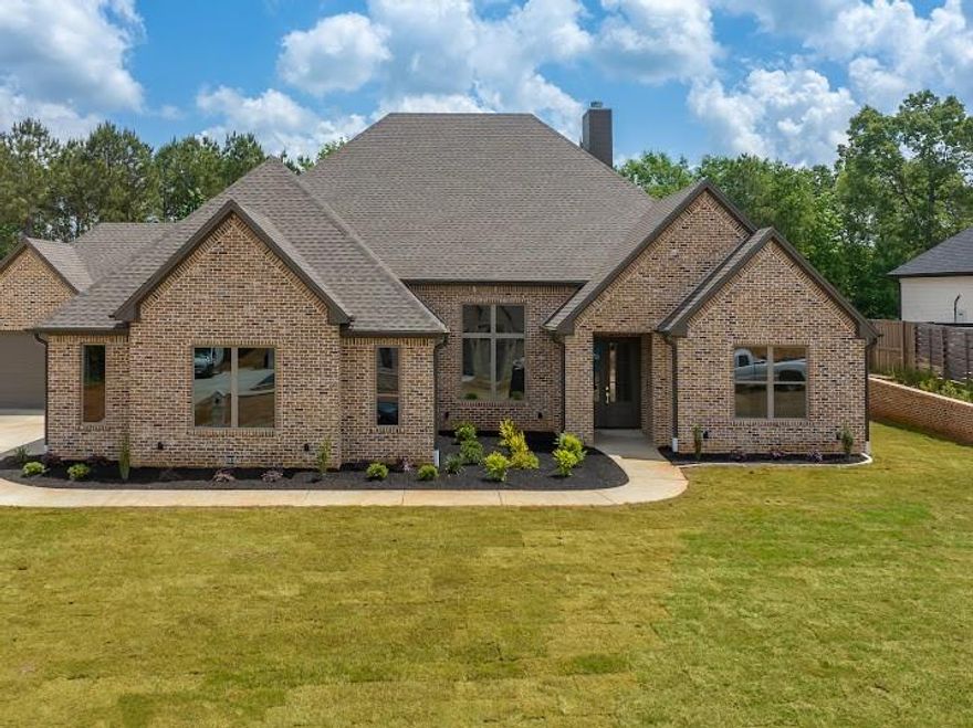 Welcome to 130 Elk Drive, a beautifully designed 4-bedroom, 3-bath home situated on over half an acre in the highly sought-after Hillcrest Trails subdivision in Longview, Texas. Built in 2025, this spacious 2,999 sq ft single-story home offers an open-concept layout with a gas fireplace and a thoughtfully designed kitchen featuring a large island and gas appliances—perfect for entertaining. The private primary suite includes a generous walk-in closet and a spa-like bath. Enjoy outdoor living on the covered patio with a view of the expansive backyard. Just minutes from dining, shopping, and local conveniences, this home offers the perfect blend of peaceful living and prime accessibility.