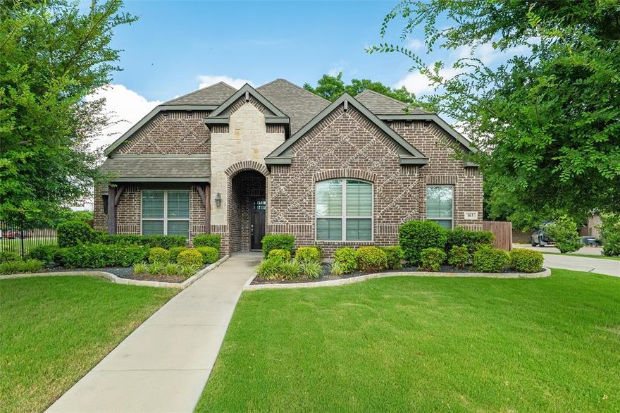Nestled in the heart of one of Waxahachie’s most sought-after neighborhoods, 103 Water Garden Drive is where space, style, and functionality meet. This expansive 5-bedroom, 3-bath home sits on a beautifully manicured corner lot and features two spacious living areas, a dedicated office, and a versatile game room—perfect for both everyday living and entertaining.

The open-concept kitchen shines with granite countertops, stainless steel appliances, and custom cabinetry, while the main living room impresses with hardwood floors, a cozy fireplace, and abundant natural light. The primary suite offers a peaceful retreat with high ceilings and a spa-inspired ensuite bath.

Upstairs, the flexible loft space and generously sized bedrooms provide room for everyone to spread out. A lush backyard shaded by mature trees offers privacy and room to play or relax.

Thoughtfully designed and move-in ready, this home blends timeless charm with modern comfort—all just minutes from schools, shopping, and dining.