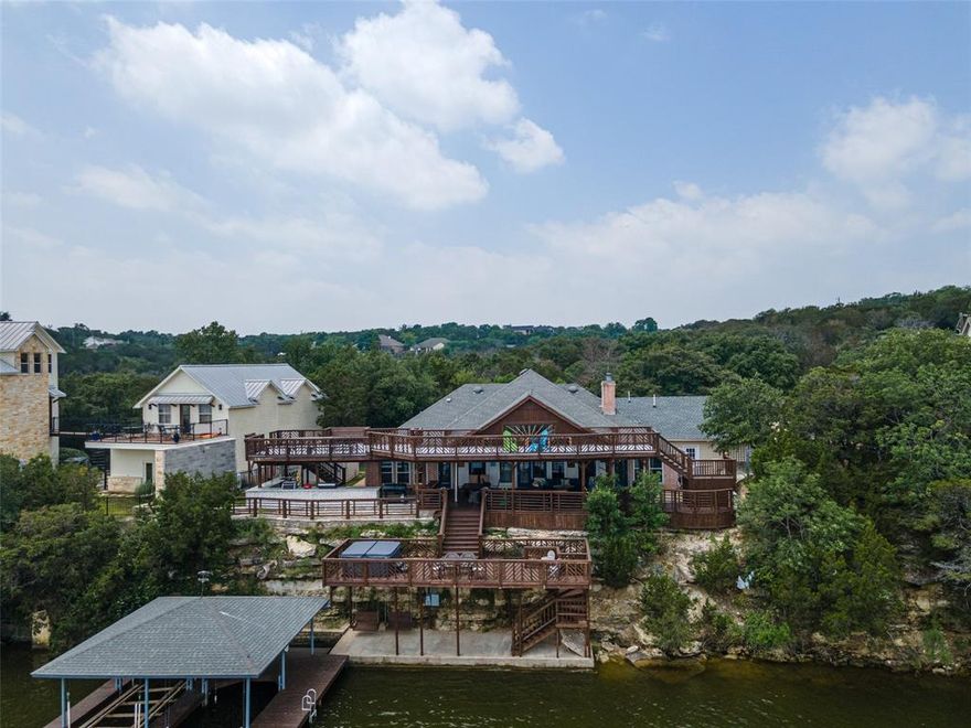 Lake living at it's finest! Come see this beautiful home located on the MAIN BODY of Lake Granbury! Welcome to this stunning lakefront property complete with breathtaking views that will leave you in awe! Step outside to the massive 3 STORY outdoor deck & living area - complete with a hot tub, to soak in the beauty of the lake & surrounding nature. With stairs that lead down to the lake, enjoy direct lake access with a private boat dock and jet ski slip. The recently expanded outdoor kitchen & cooking area make it ideal for hosting gatherings & dining with loved ones all while taking in the sights of the main body on Lake Granbury. The inside of the home has been completely remodeled and features modern finishes with a bright, beautiful open layout, perfect for entertaining. Whether you are looking for a permanent home, vacation home, or investment property, this home has it all. With its prime location, there are endless possibilities for enjoyment & a return on investment. Don't miss out on the opportunity to own this beautiful lakefront property that is ready for you to start creating unforgettable memories. Property includes adjacent lot in cul-de-sac, that makes the total land size over one acre. Schedule your showing today and discover what true luxury life and lake front living provides.
