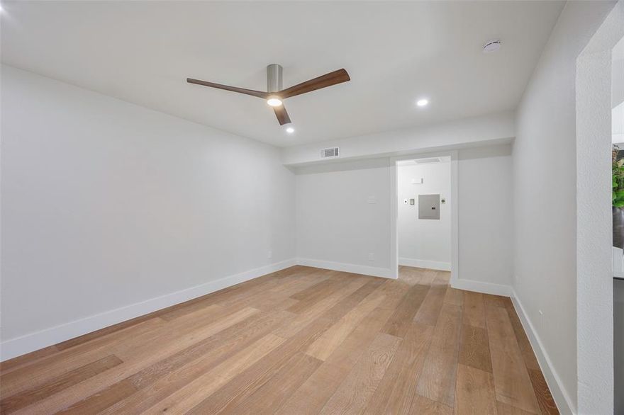 Located walking and biking distance from SMU, right off of Greenville, and with close access to Dart rail.  Interior completely redone. Custom new cabinetry, all with a 25 year manufacturer's warranty.  Recessed lighting, distressed hardwood plank floors, and high end appliances including an induction cooktop, and a convection hot air fryer oven.  Lots of hidden features for such a small space.  Updated electric.  Renovated bathroom with walk-in shower.  Custom fitted fridge and stackable washer and dryer both included in full price offer.   Private outdoor patio.  Gated access with clicker.  Parking spot located right by the door.
HOA dues cover electric, water, trash and septic.