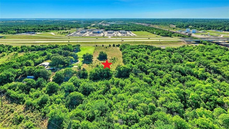 Beautiful 6.2 AC land in the growing city of Denison on US 75. Located an hour north of the DFW metroplex on Hwy 75 access road. This property features 216 feet of road frontage, rectangular in shape, and over 6 acres of land, and offers multiple opportunities for development. The current zoning is Agricultural and is located in the Highway Oriented and Corridor District. Land is ~10 min away from $6 Billion community with Margaritaville Resort that is coming to Lake Texoma (Denison) and is close to the proposed Dallas North Tollway expansion project. Huge opportunity to unlock value through development or simply buy and hold. Beehive AG exemption in place. Land is in City limits. Electric available and water line is located just off Hwy 75.  Seller is related to listing agent. Buyer and Buyer's agent to verify all information.