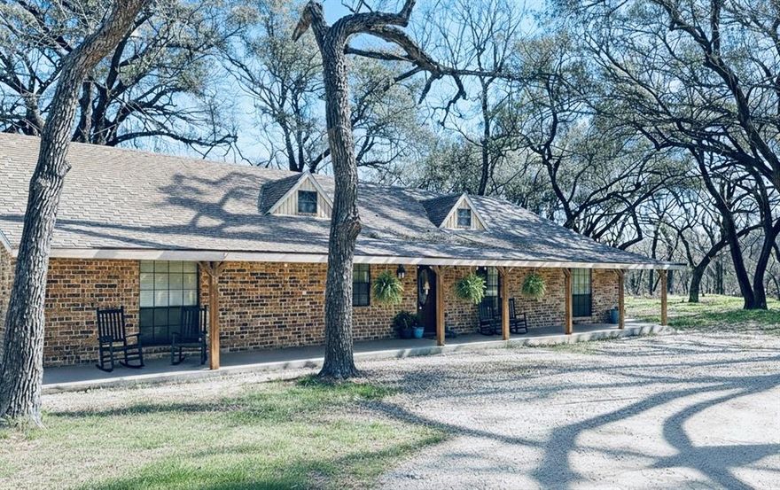 Wanna feel secluded but still close to town?  This is the place!  Surrounded by huge oaks and an amazing creek that borders the back, this places is simply heaven.  4 bedrooms 2.5 baths, updates, fireplace, and a GUEST cabin all on over 15 acres!  Come take a look today before it's gone!