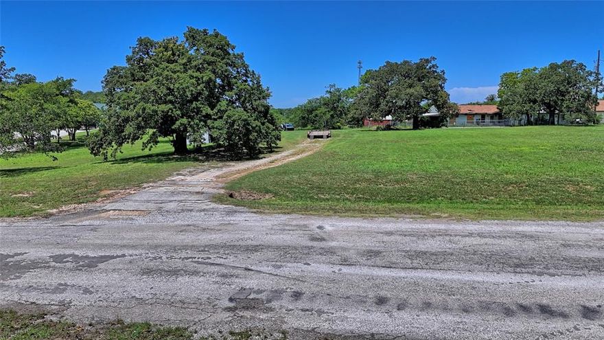 This 2.58-acre property, located within the city limits of Bowie, Texas, is covered with mature, beautiful trees and lush green grass, offering a peaceful and scenic setting. Zoned for residential use, the property once had a house that has since been removed. Because the parcel is comprised of Lots 3–8 in Block 3 and Lots 4–8 in Block 4 of the Ingram Addition and has access from two to three city streets, the land presents an excellent opportunity for subdivision or private development. City utilities are believed to be available near Mill Street, adding to its convenience. The location is ideally close to Bowie High School, with easy access to Highway 287 for commuting, and spacious enough to provide privacy while remaining connected to the community. This is a rare chance to own a piece of countryside charm in a prime urban setting, ready for you to bring your vision to life.