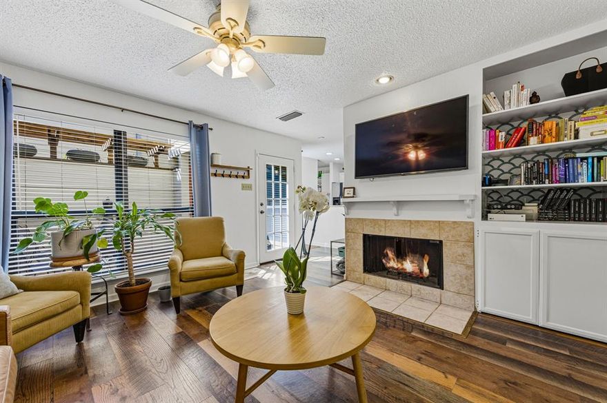 A charming front courtyard welcomes you to this centrally located condo in the heart of Dallas. Filled with natural light, this spacious townhome offers two bedrooms, one full bath, and a convenient half bath. The inviting living area, anchored by a cozy fireplace, flows seamlessly into the open kitchen and dining space. The kitchen features ample countertop space and a rare expanded layout with additional cabinetry — perfect for maximizing storage and entertaining. A separate dining area just off the kitchen provides the ideal spot for a bistro table or a work-from-home setup.
Downstairs also includes a half bath with a tucked-away laundry area for added convenience. Upstairs, the generous primary suite boasts a walk-in closet, while the secondary bedroom offers great space and storage. The recently updated full bath features dual sinks with granite surrounds, stylish navy blue cabinetry, and neutral tile finishes. **New HVAC installed March 2024**
Enjoy access to the community pool and two dedicated parking spaces. Ideally located just steps from the Katy Trail, with easy walks to West Village and the Knox District’s shops, dining, and grocery stores — and just minutes from the highly anticipated Auberge Hotel & Residences luxury development coming to the Knox District.