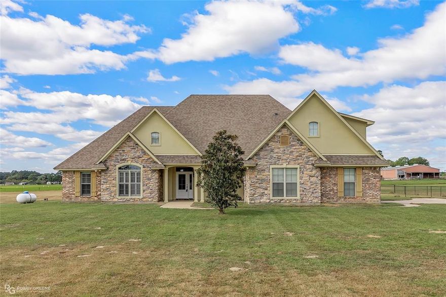 Country Elegance Meets Modern Living in Shreveport
Nestled on a large 3-acre lot, this 4-bedroom, 4-bathroom residence offers a perfect blend of country living and modern luxury. Thoughtfully designed, the home showcases a functional open floor plan that effortlessly connects spacious living areas, making it perfect for both intimate gatherings and grand entertaining.
The gourmet kitchen has granite countertops, complemented by the top of the line fixtures and ample cabinetry.
This residence features two primary bedrooms conveniently located on the first floor, each offering privacy and comfort with en-suite bathrooms designed for relaxation. There is an additional bedroom downstairs and a fourth bedroom upstairs with a full bath. Outside, country living comes to life. 3 acres of rolling greenery, a canvas for creative landscaping, gardening pursuits, or simply enjoying nature's ambience. The property also includes a spacious two-car garage, providing practical convenience and plenty of storage options.
This residence offers a lifestyle opportunity like no other. A chance to enjoy open-plan luxury without compromising the tranquility of a country setting. Make this Shreveport treasure your own sanctuary today.