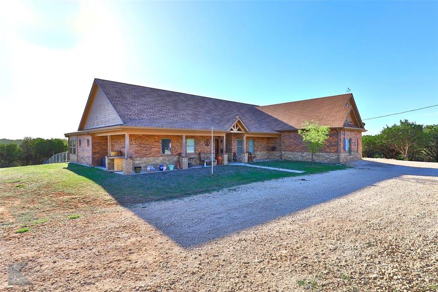 If you want to be removed from the hustle and bustle of town, then you need to see this one! It's nestled perfectly on over 23 +or- secluded & private acres with mature oak trees, cedars & scenic pastures plus  priced to sell! This immaculately taken care of, one owner home is located in Jim Ned ISD. Custom built by Rex Miller, this flawless residence offers relaxed living with remarkable views and breathtaking sunsets. It is here you will discover the endless attention to detail that can be found around every corner.  Offering 4 bedrooms and 3 full baths plus a half bath allows for plenty of space for large gatherings with friends and family not to mention the separate office space which makes working from home a dream out in the country. The downstairs primary suite has a beautiful sun porch attached that is heated and cooled so you can enjoy your morning coffee year round while looking out onto the picturesque ranch land. The rustic and comfortable great room boasts a wood burning fireplace with ceiling-high stone work, tile floors throughout and so many pluses around every corner like the HUGE walk in pantry and multiple storage closets, an oversized garage and massive flex room upstairs which includes a full bath with walk in shower. This flex space would make a great second primary, guest suite or extra long-term living quarters. There is plenty of space for all of your oversized furniture with room to spare. Nothing was left out in building this custom home. The property is fenced & cross fenced & also includes partial high fence. The land is beautiful and hosts plenty of deer and wildlife for your enjoyment. Don't forget to say hi to the donkeys when you're taking a look at this amazing property. Call to schedule your appointment for a private tour today!