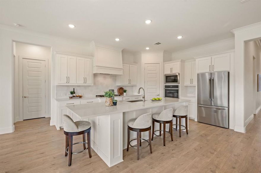 This elegant and modern single-story residence offers a functional, open-concept floor plan designed for both comfort and versatility. The spacious living, kitchen, and dining areas flow seamlessly together and overlook a large, private backyard that backs to a serene greenbelt—perfect for relaxation or entertaining. A versatile flex room can serve as a game room, home gym, guest suite, or mother-in-law retreat. The gourmet kitchen features high-end appliances, including a Thermador refrigerator and upgraded GE Monogram gas cooktop, along with a custom California Closets–designed pantry for exceptional organization. The primary suite provides a true retreat, complete with a spa-inspired bath and a custom California Closet. Thoughtful details include custom Roman shade window coverings throughout and abundant storage space. Enjoy outdoor living under the covered patio with plenty of room to add a pool! Located within the desirable Northwest ISD, this home combines luxury, function, and tranquility in one perfect package.