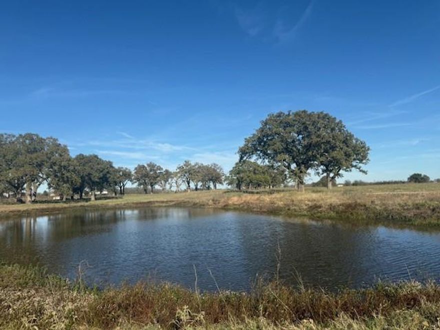 This 20 acre tract of ag exempt, well maintained coastal pasture is dotted with mature oak trees and has two ponds! Tucked conveniently close to Hwy 274, just minutes away from conveniences while still appreciating very quiet and serene country style location. 
This tract will be subject to any future homes being constructed to be site built only, no manufactured housing allowed. Beautiful tract of grazing land, fully fenced. Buyer will need new survey to confirm fence lines which should be bordering this 20 acre tract. This parcel has been well maintained as a coastal pasture and rotated with cattle for years. It is a beautiful option for someone who wants a nice ag exempt tract for low maintenance pasture or to build in the future. 
The seller of this tract is the adjoining pipe gate entry on the West side of the tract, please do not disturb the seller, but instead call listing agent for more information and permission to walk this beautiful tract!
Tract road frontage is approximately 500'x1513' deep and to be confirmed with new survey.