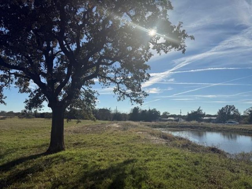 This 20 acre tract of ag exempt, well maintained coastal pasture is dotted with mature oak trees and has two ponds! Tucked conveniently close to Hwy 274, just minutes away from conveniences while still appreciating very quiet and serene country style location. 
This tract will be subject to any future homes being constructed to be site built only, no manufactured housing allowed. Beautiful tract of grazing land, fully fenced. Buyer will need new survey to confirm fence lines which should be bordering this 20 acre tract. This parcel has been well maintained as a coastal pasture and rotated with cattle for years. It is a beautiful option for someone who wants a nice ag exempt tract for low maintenance pasture or to build in the future. 
The seller of this tract is the adjoining pipe gate entry on the West side of the tract, please do not disturb the seller, but instead call listing agent for more information and permission to walk this beautiful tract!
Tract road frontage is approximately 500'x1513' deep and to be confirmed with new survey.