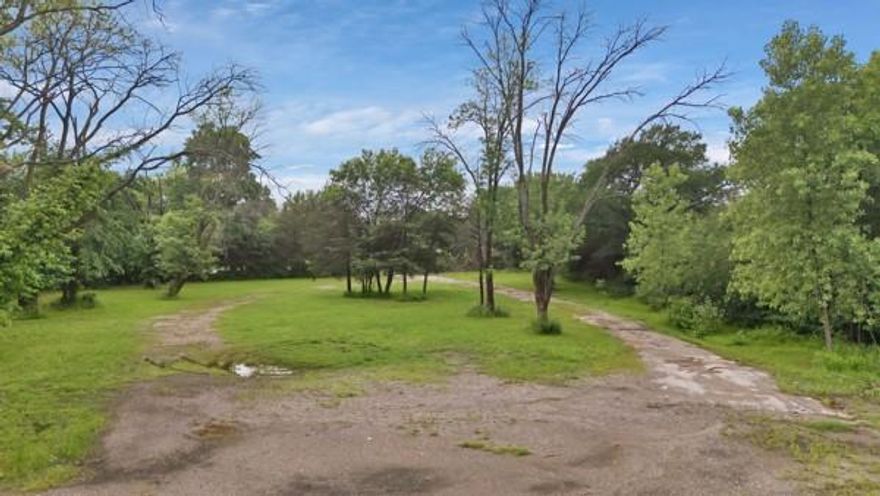 MOTIVATED SELLER, BRING ALL OFFERS! 
Commercial unimproved property surrounded by a mixture of high-traffic businesses located near major highways 20 and 45. This property is an open canvas for a wide range of commercial opportunities, perfect for an investor looking to build on a prime location.