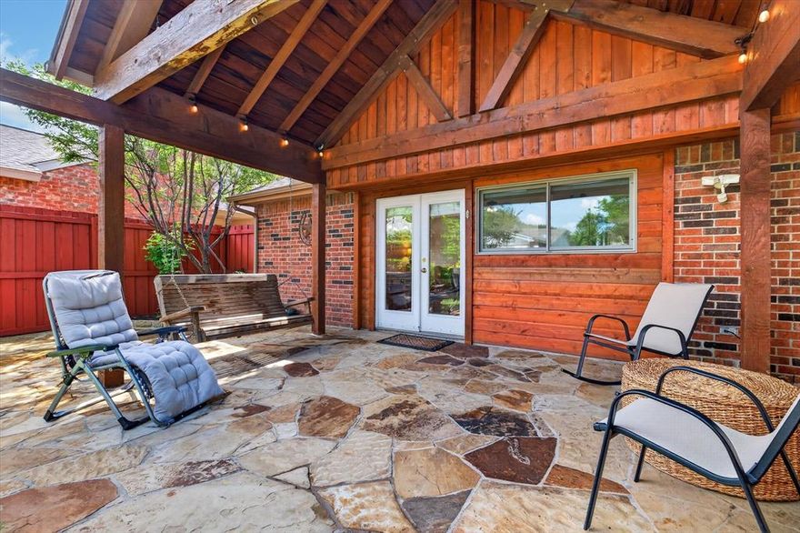 Single-story ranch-style home featuring 3 bedrooms and 2 bathrooms. Open Floorplan with Living area at entrance with stone faced wood burning fireplace as focal point leading into the dining and kitchen. The updated kitchen offers granite countertops, a center island, and custom display cabinetry perfect for both everyday living and entertaining. Hardwood flooring runs throughout the main living areas, complemented by tastefully updated bathrooms. Primary spacious bedroom with wood floors and walk-in closet and complimentary secondary bedrooms with ceiling fans and walk-in closets. Step outside to a covered patio with a cedar awning, surrounded by lush landscaping and a slate patio ideal for relaxing or hosting guests. The backyard is enclosed with a board-on-board privacy fence for added seclusion. Recent roof and HVAC pump replacement and water filtration system throughout the entire home adds peace of mind. Conveniently located near a lake, parks, and scenic jogging trails.