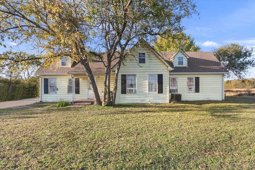 Discover the potential of this spacious property situated on approximately 3.3 acres, offering room to grow, expand, or create an investment opportunity with the ability to build one to two additional homes. Located on a generous corner on the edge of town, this property provides expansive outdoor space, mature trees, and plenty of possibilities for future use.

The residence features a large living area with original hardwood flooring, multiple versatile rooms, and vintage features throughout. Several areas of the home are in need of repairs and updating, making this an excellent opportunity for someone seeking a project with long-term upside.

Outdoor features include a detached garage, open yard space, and a lot of mature trees making it ideal for recreational use, gardening, or additional structures. Whether you’re looking to renovate, expand, or invest, this property delivers the acreage and flexibility to bring your plans to life.

This is your chance to create something truly special with land that offers room for vision, creativity, and long-term value.