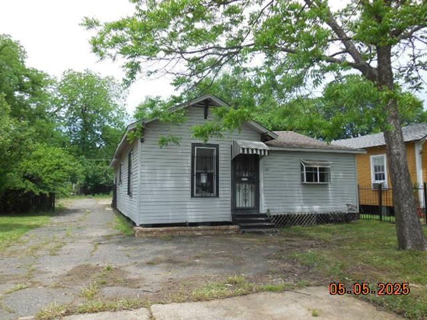 Fenced in yard with covered parking and storage building. Property sold in as is condition.