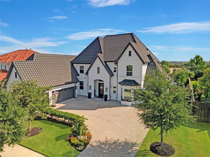 Step into unparalleled luxury with this exquisite Mediterranean-style home, nestled in a prestigious gated community in Frisco, offering 24-hour security for peace of mind. Boasting 6 spacious bedrooms and 6.5 elegantly designed bathrooms across 5,211 square feet, this home is a true masterpiece of modern comfort. Walking distance to Liscano Elementary School. Every inch of this home has been thoughtfully upgraded, from the hail-resistant Class 3 roof and advanced lightning protection system to the entire-house water purification and softener systems. The expansive 90-foot lot, a rare find in Frisco, offers a large, private backyard perfect for entertaining. Primary closet is attached to a bedroom perfect for a nursery or an office. Dive into your oasis with a heated pool, with an ozone purification system, a large tanning ledge, thrilling slide, and an 8+ person spa—installed just last year. The 4 car garage features pristine epoxy floors, adding a touch of luxury to everyday living.