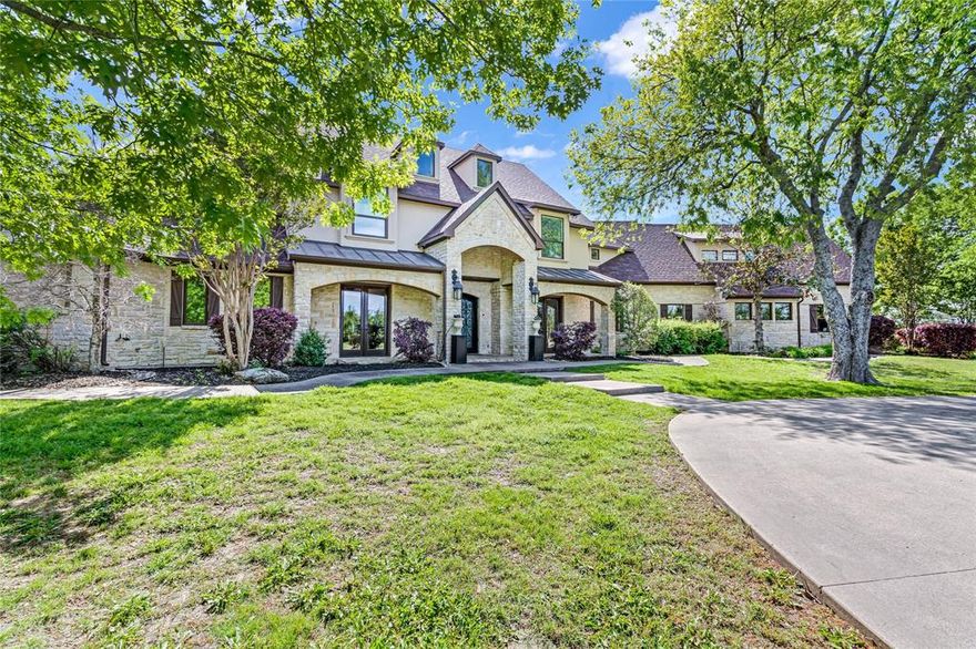 Extraordinary 3-acre estate in Rockwall. Reminiscent of Mission-style Montecito mansion with beautiful architectural touches, luxurious amenities, and glorious fixtures.  Rough-hewn exposed beams, hand-painted tiles, hammered copper sinks, gorgeous carved doors, elegant rod iron, and more. Wherever you look, every convenience is available, from coffee-wet bars to a commercial-grade kitchen. Primary suite with fireplace will stun with elegant spa-like bath. Outside resort-worthy oasis with covered patio, heated saltwater pool with slide, hot tub, and picnic pavilion. There’s also a 70X75, 2-story shop with full utilities, RV parking, and apartment. Words and photos only begin the story. See it now.