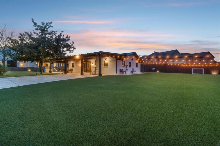 Perfect for entertaining indoors and out, this extraordinary estate offers 6,422 sq. ft. in the main residence plus a 2,202 sq. ft. guest home, combining 8,600+ sq. ft. of luxurious living space. Every detail reflects craftsmanship, comfort, and thoughtful design. Built on a reinforced slab foundation engineered to minimize settling, with hail-impact resistant metal roof and full closed-cell foam insulation, including garage, for efficiency and soundproofing. The living room impresses with soaring 28’ vaulted ceilings, white stone fireplace, custom cabinetry, and chandeliers. The dining room features accent fireplace, coffee-tea bar, and close by a bar with sink, icemaker, and mini-fridge. The spacious kitchen accommodates professional appliances suited for a gas range along with a commercial grade vent hood, double ovens, 4-door refrigerator, dishwasher, pot filler, porcelain farm sink, custom cabinetry, and magnificent quartzite island. Space also features a spacious pantry, mudroom, and laundry room. The owner’s suite offers backyard access, spa-like bath with soaking tub, rainfall shower, dual sinks, and a custom walk-in closet with center island. Additional bedrooms are spacious feat. walk-ins and unique finishes. Amazing amenities to the home include a theater room, office, and gym-guest room. Outdoor living shines with stamped concrete patios, outdoor grills, fire pit, basketball court, dog run, turf yard, retaining wall, and automatic gate. Gas generator provides peace of mind. The guest home, complete with its own kitchen, cedar porch, metal roof, and stained concrete floors, is perfect for extended family, Airbnb, or rental income. Highlights include custom wood floors, porcelain tile baths, maple doors, pine framing, smart wiring, zoned high-efficiency HVAC, and dual smart irrigation systems. Within ALLEN ISD, A TOP-RATED SCHOOL DISTRICTS!
Buyer and buyer agent to verify all information. Information deemed reliable but not guaranteed.