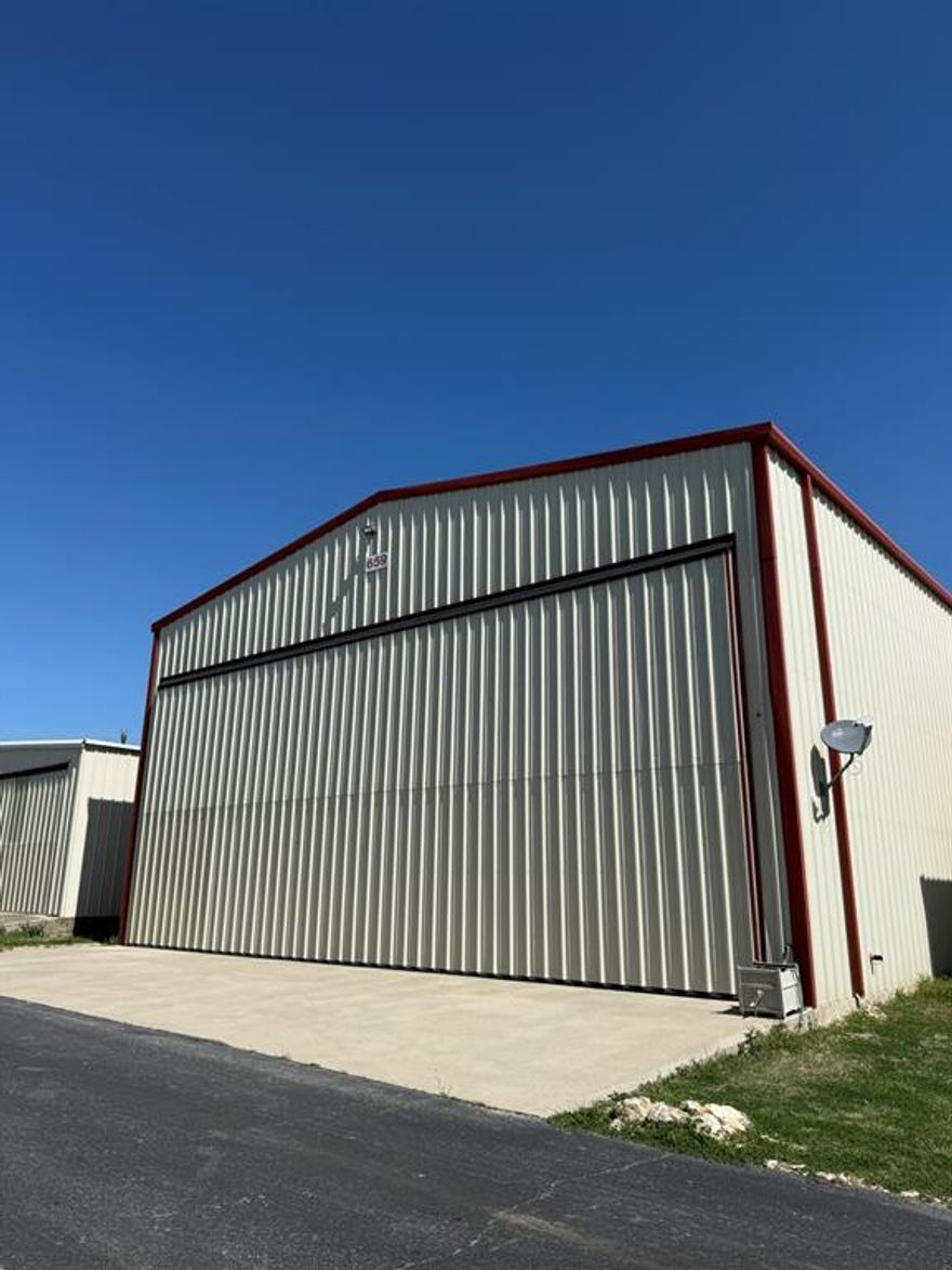 This exceptional hangar at Hicks Airport is as complete, versatile, and as utilitarian as they come.
Not all hangars at Hicks are created equal. The 46-foot wide bi-fold door and generous door height set this one apart, accommodating everything from a the largest piston twins, or easily a few sport planes, to a Class A motorhome under one roof with a dedicated 50-amp electrical hookup and RV plumbing connection already in place.
The living quarters are equally impressive. A recently renovated 2-bedroom, 2-bathroom apartment upstairs offers modern, comfortable living with a private balcony overlooking the north approach to the airfield. Downstairs, an additional living area with a full bathroom handles guests, overflow, or whatever you need. Solar panels on the roof help keep electricity costs manageable year-round.
The bottom line? Everything has been done here. Whether you're a pilot looking for the ultimate live-work setup, an A&P IA ready to hang your own shingle, or a flying family that wants room to grow, this hangar has you covered... probably just about until you're ready to step up to a King Air.
Hicks Airport is a fantastic aviation community, and this is one of if not the best available hangar at Hicks.
Don't wait. Turnkey hangars like this are few and far between.

Information herein is believed to be accurate and has been obtained from sources deemed reliable; however, buyer is responsible for independently verifying all information to their own satisfaction. All measurements, features, and amenities should be confirmed prior to closing. Broker makes no warranties, expressed or implied, regarding the accuracy of this information.