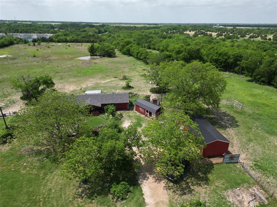 14.189 acres of prime land in a serene country setting, ready for redevelopment or your future homesite. While an existing house remains on the property, it is offered strictly as-is, contributing little to overall value. The true value lies in the land itself, the utilities already in place, and the additional improvements: a quality insulated storage building with electricity and a detached garage-storage perfect for equipment and tools.

The property boasts beautiful mature pecan trees, a seasonal pond, fencing, and a welcoming tree-lined approach offering an appealing backdrop for future plans. Utilities are already in place, making redevelopment easier.

Conveniently located just 3.5 miles from Hwy 121, with easy access to McKinney, Prosper, Frisco, Sherman, and Bonham. Shown by appointment only to qualified buyers who understand the as-is nature of the home. This is a rare opportunity to secure acreage with existing infrastructure ready for your vision.