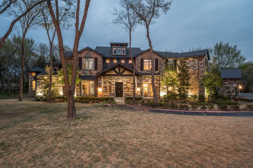 Stunning custom-built home on 3-acre wooded estate in Whispering Farms, Prosper. The expansive driveway provides easy access to the home's grand entrance and leads to a spacious 6-car garage; with room for multiple vehicles and additional storage. Inside, the home has impressive high ceilings and a dramatic two-story stone fireplace. The kitchen is a chef's dream, with an oversized island, farmhouse sink, top-of-the-line appliances and plenty of storage. The master suite is truly an escape with its own fireplace and expansive windows. The main floor also includes a guest bedroom and beautifully appointed office with built in shelving with french doors. The centerpiece of this property is the backyard oasis that includes a 2 story stone fireplace, outdoor kitchen, numerous seating and dining areas surrounding a sparkling pool with a spa. Whether you're looking for a serene escape or a place to entertain friends and family, this property is sure to exceed your expectations.