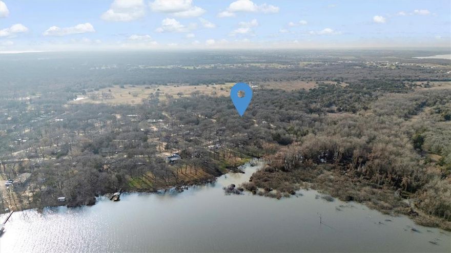 Great opportunity to own adjacent lots (809 Wood Duck Terrace AND 813 Wood Duck Terrace together OR separate)! Over three quarters of an acre in the beautiful Quinlan, just minutes from Tawakoni Lake and Walnut Cove Marina, perfect for hunting, fishing at the nearby lake, or building.  This lot features mature trees, offering a serene setting for your future plans. No survey available. Utilities are available at the street. Buyer or Buyers Agent to verify all info, zoning, and easements.