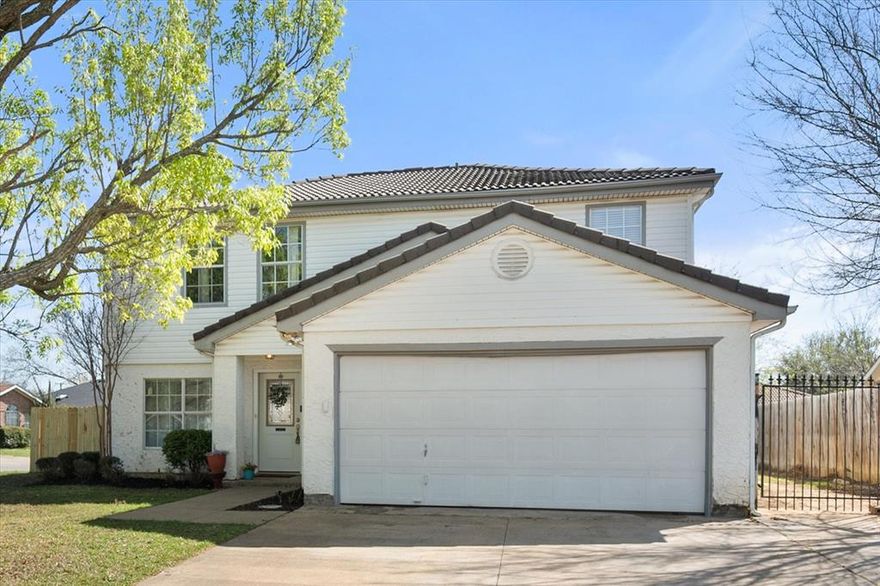 Welcome to 2700 Yorkfield Ct., tucked on a quiet corner lot in the established York Meadow neighborhood of SW Arlington and zoned to highly regarded Mansfield ISD. This charming two-story home offers 4 bedrooms, 2.5 baths, and 1,855 square feet of comfortable living space designed for both everyday life and easy entertaining. Step inside to find the first of two inviting living areas filled with natural light and durable luxury vinyl plank flooring that flows throughout the main spaces. The open layout connects the living and dining areas, creating an easy flow for gatherings. The kitchen features granite countertops, stainless appliances, ample cabinetry, and a sunny eat-in breakfast nook overlooking the backyard. Just off the kitchen, you'll find a generous-sized flex space, easily accommodating a remote worker's home office or the young ones in your life looking for a dedicated play room. Upstairs, the spacious primary suite offers a relaxing retreat with double vanities, a garden tub and two walk-in closets, while three additional bedrooms provide flexibility for family, guests, or a home office. Outside, the large fenced backyard is ready for weekend BBQs, pets, play, or future garden plans. An oversized covered patio provides the perfect spot to either wake up while enjoying that morning cup of coffee or to unwind in the shade on a beautiful Texas evening. Located within walking distance to neighborhood schools and near shopping, dining, and major commuter routes, this home offers the convenience today’s buyers want while maintaining the charm of an established neighborhood. If you’ve been searching for a move-in ready home with space, natural light, and a great layout in South Arlington, this one checks all the boxes!