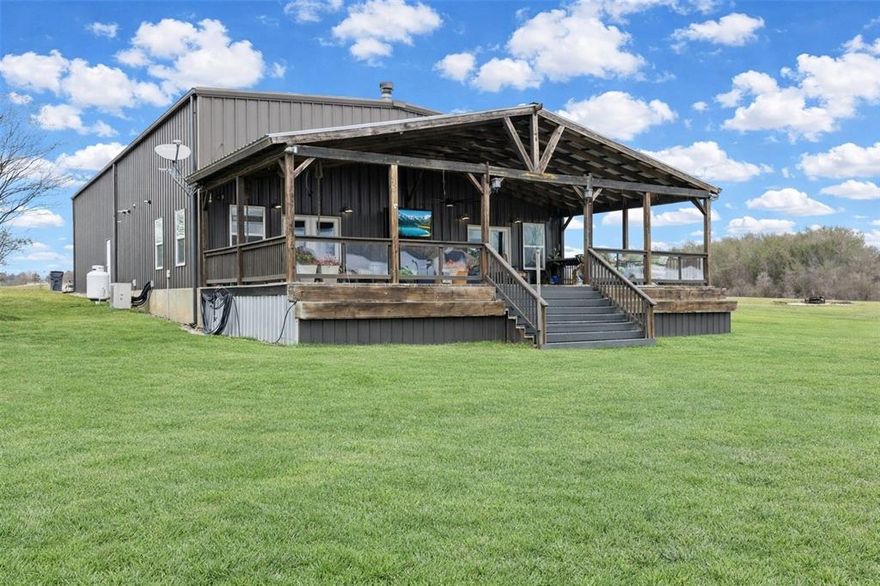 Discover exceptional lakeside living in this beautifully finished waterfront barndominium on Lake Fork. Offering 2,261 sq ft, 3 bedrooms, and 1.5 baths, this property is designed for comfort, functionality, and the perfect lake lifestyle.

Enjoy the outdoors from the expansive 20’ x 40’ covered back deck, complete with a mounted TV and inviting bed swing—ideal for relaxing or entertaining. Your private fishing pier with a sun deck and installed fish habitats provides outstanding fishing access just steps from the home.

The downstairs master suite features French doors opening to the back deck, a spacious walk-in closet, and a walk-in shower. The open-concept living room, kitchen, and dining area centers around a cozy wood-burning fireplace and is enhanced by sliding barn doors and an impressive oversized windmill ceiling fan.

The kitchen is beautifully appointed with stainless steel appliances, double oven, and a central island, offering plenty of prep and gathering space.

A standout feature is the massive 40’ x 45’ insulated garage, complete with two large roll-up doors and abundant room for boats, lake toys, vehicles, or workshop needs. A full RV hookup adds convenience for guests. An interior staircase leads to the second and third bedrooms, creating a private and versatile upper-level layout. The oversized driveway provides ample parking for additional vehicles, trailers, or RVs.

The low HOA dues of just $52 per month grant access to resort-style amenities, including stocked fishing ponds, a saltwater swimming pool, playgrounds, basketball courts, horseshoe pits, and covered picnic areas. The community also offers a lively social calendar with holiday celebrations and weekly clubs. A dual-well filtration system & sewer service start at just $65 each per month plus usage. High-speed internet via both satellite and fiber-optic providers. Bring your golf cart, ATV, UTV, and fishing gear.