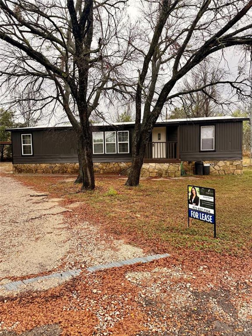 Discover comfortable and updated living just moments from Lake Granbury! This charming manufactured home is situated on a large, spacious lot, offering plenty of room for outdoor activities, relaxation, and privacy.

The interior has been recently refreshed with new paint and new flooring throughout, providing a bright, clean, and modern feel that is ready for immediate move-in. Enjoy the convenience of easy access to the water and all the recreational opportunities Lake Granbury offers, while maintaining a quiet, private residential setting. The property is zoned for the highly-regarded Granbury Independent School District (GISD).