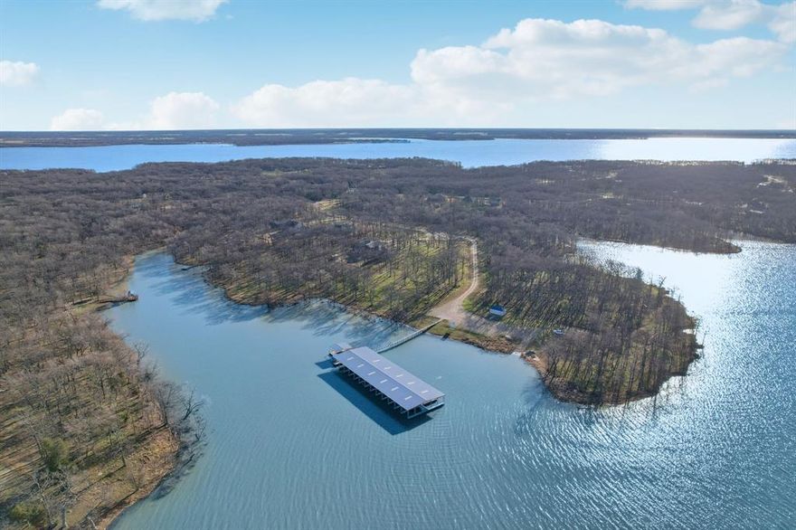 Seller financing Owner financing available (also known as owner carry, seller carry, seller finance, OWC, OF, OFA). Terms negotiable.

Over 3 Acres of Waterfront Access for Under $350K!
Located in Hunt County’s exclusive Nautical Shores on Lake Tawakoni, this 1.12-acre buildable waterfront lot includes exclusive leaseback rights to 2+ additional acres, giving you over 3 acres of usable lakefront land—a rare opportunity in an amazing lake community under an hour from Dallas.

Perfect for downsizers, second-home buyers, or anyone seeking a peaceful lake retreat with investment upside. The lot is cleared and ready to build, surrounded by mature trees and offering panoramic open-water views. Build now or later—no construction deadlines and no builder restrictions.
Flexible build options: 1,400 sq ft minimum (1-story) or 1,800 sq ft (2-story). Bring your own builder with no timeline to complete!

Enjoy private marina access, paved roads, and underground utilities. Located in one of Texas’s fastest-growing counties, this is your chance to secure rare waterfront acreage before prices rise with continued regional growth in Hunt and Kaufman Counties.

Schedule a tour today!