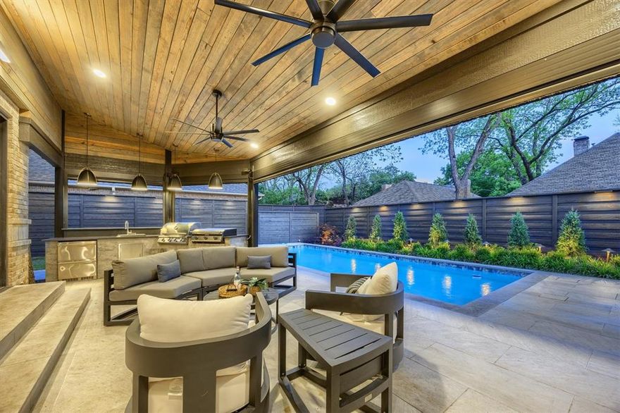 Fully reimagined and taken down to the studs, this home blends modern design with thoughtful functionality and exceptional craftsmanship. Walls and ceilings were opened, floors leveled, and steel beams installed to create a dramatic, open-concept layout, just begging to host parties and entertain guests.  From the grand entrance, you’ll notice the striking open staircase, Italian tile accent walls, and the beautiful seamless flooring throughout, all complemented by Level 4 wall finishes, integrated art lighting, and a discreet, high-efficiency cooling system.
The sleek, contemporary kitchen features premium Viking appliances, a Sub-Zero refrigerator, a walk-in pantry, and a dedicated coffee station with a Miele built-in system- perfect for slow mornings or hosting with ease.
The private primary suite is a true retreat, offering direct access to the pool and a spa-inspired bath with an oversized walk-in shower, soaking tub, and a custom-designed closet built for both beauty and organization.
Two staircases lead to a versatile living space above, ideal for a game room, office, or playroom, along with four additional bedrooms featuring walk-in closets and well-designed split bathrooms.
The entertaining space continues as you open the large sliding wall of windows and step out onto the covered patio, which features electric screens for year-round comfort, a fully equipped outdoor kitchen with a gas cooktop and Blackstone grill, and a newly installed pool. 
This unique, one-of-a-kind home is located in one of N. Dallas’ most sought-after neighborhoods, just minutes from Preston Road's premier dining and shopping, and with quick access to George Bush Turnpike and the airport. Zoned to highly regarded Plano ISD schools, this home has everything your growing family could need. 
All TV's convey, and all furnishings are negotiable!