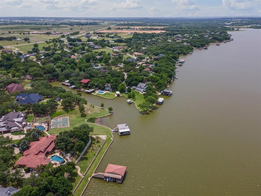 MOTIVATED SELLER>>>>Here's your WATERFRONT LAKE house retreat that is truly a hidden GEM. Located at the end of the street with 2 driveways, in a QUIET, SMALL neighborhood close to the town square and all the necessities. METICULOUSLY cared for and maintained 1641sf 3 bed 2.5 bath main house with open concept, separate1 bed 1 bath 360sf GUEST QUARTERS with kitchenette, full bath, washer dryer hookups and private patio overlooking lake, Lg covered patio and detached garage. NO city taxes and NO HOA. BOAT DOCK with lift and floating JET SKI parking. TURN KEY property can be your lake house, second home, or short term rental. 12x16 metal building with roll up door, 8x10 shed. Fish cleaning station and fish shed with electricity. LUSH Landscaping is in full bloom and makes you feel as though you are in your own paradise. Custom made covered lakefront deck to relax and enjoy the lake views. Lake pump with remote for watering. FIRE PIT to relax by. Large laundry room with storage. Complete with SS refrig and washer dryer convey. Fish for dinner and enjoy the all you can eat CRAPPIE. Heated and cooled 7 x 23 sunroom off of main house with plenty of windows to take in the water views. Lg deck off of sunroom too. Possibly use as 1 or 2 Airbnb's. Too much to list so schedule your showing ASAP!