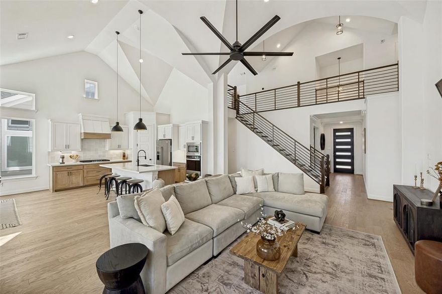 A rare opportunity to own a one of a kind modern farmhouse just minutes from Downtown McKinney, with easy access to shopping, dining, and everyday conveniences.

Designed for both daily living and effortless entertaining, this 5 bedroom home offers two bedrooms on the main level, a private home office with barn door, and an upstairs game room wired for surround sound. The groin vaulted family room creates a stunning focal point with a sleek linear fireplace and floor to ceiling stone.

The open concept kitchen blends function and style with shaker cabinetry, Omegastone slab countertops, a large island, stainless steel appliances, a 5 burner gas cooktop, and thoughtful storage throughout.

The primary suite is a true retreat featuring a spa inspired bath with a freestanding tub, dual vanities, a designer tile shower, and direct access to the laundry room.

Step outside to a covered patio with a fully equipped outdoor kitchen, perfect for hosting or relaxing year round.

Additional highlights include 8-foot doors on the main level, a full oak staircase with wrought iron balusters, and energy-efficient features including R38 insulation and a radiant barrier roof deck.