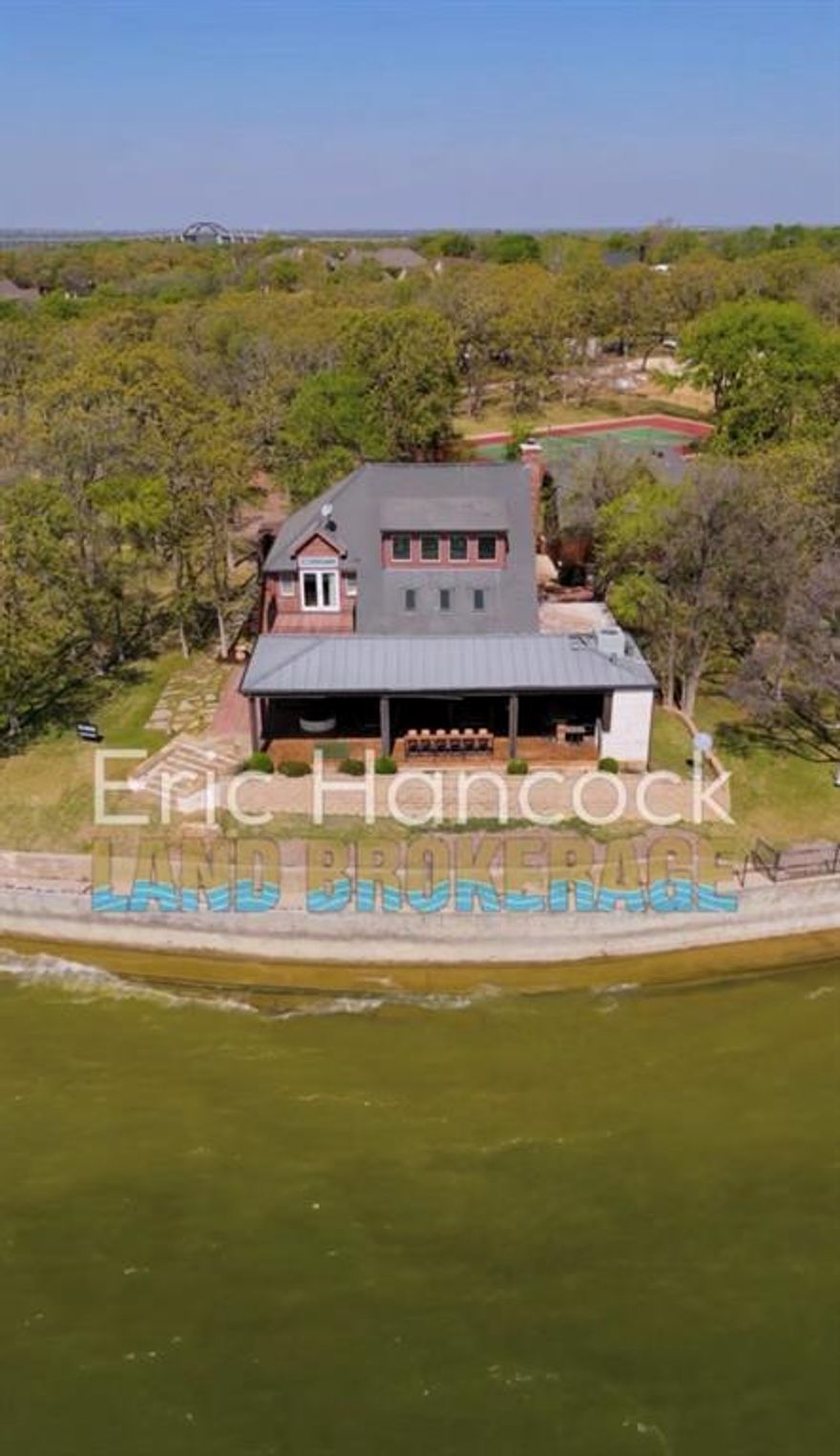 Tear down home and you can build on the best lot on the lake! Or, we can tear down for you upon closing. Huge panoramic lakefront with southern breezes, Sunrise to sunset views!! Lake lots are very rare and lots like this do not exist- so come build your TRUE LAKEFRONT DREAM HOME while you can!!