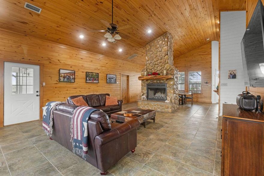 Welcome to 1671 Terry Lane in Sherman, Texas — a stunning 11-acre property located in the sought-after Pottsboro ISD. This 4-bedroom, 2-bath home offers the perfect blend of comfort and country living. Enjoy outdoor relaxation with a sparkling pool, hot tub, and a convenient pool shed complete with a bathroom. The impressive barn features 8 stalls, a wash bay, hay stall, and a tack room, ideal for equestrian enthusiasts. The expansive party barn is designed for entertaining, featuring a kitchen, bar area, men’s and women’s restrooms, stereo system, band platform, and a covered round pen out back. A nearly 100-foot carport runs alongside for ample covered parking. Additional highlights include 7 loafing sheds and a storm cellar, making this property as practical as it is beautiful.