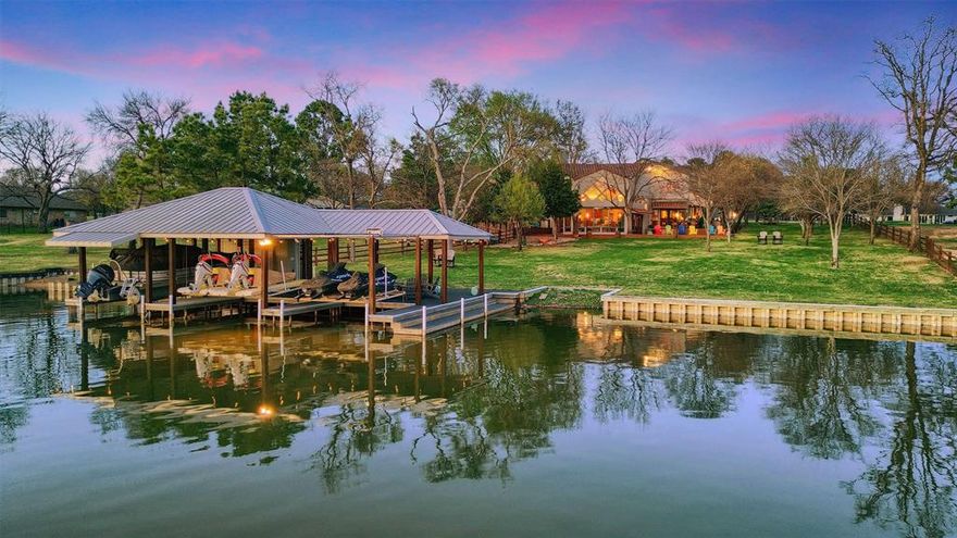 The opportunity to own a truly special lakefront estate is here! 108 Chippewa Cove is located on a small cul-de-sac in the prestigious and private Lake Kiowa community. Upon entering, two tranquil ponds with water features and a large circle drive welcome guests to the property.  The lot is well over an acre and features views of the Lake Kiowa PGA-rated golf course’s signature hole. The exquisite southwest style home is full of thoughtful details and beautiful interior design. The front door opens to a large gathering area with a wall of windows overlooking the lake, a stone fireplace, and a vaulted wood plank ceiling.  The open floor plan allows an easy flow between the living area and kitchen. Cabinetry throughout is custom and features artistic finishes and custom made hardware. The primary suite has its own fireplace and access to the back yard. The primary bathroom features beautiful tile work and a steam shower. The walk in closet doubles as a safe room, and has an upstairs area for use as an office or extra storage. A second primary on the first floor also features an en suite bathroom with colorful tile and dual vanities. Upstairs is a large room perfect for a bunk room or game room with a dedicated full bathroom. Outside, almost 3000 square feet of porches and multi-level decking offer unparalleled views of the lake and golf course. The expansive boat dock can accommodate multiple watercraft. The dock also provides storage, room for a seating area, and an outdoor shower. An oversized garage with storage rooms and golf cart entrance thoughtfully contains extra materials for any future additions or repairs. Plans for expanding the home are available. Furnishings are negotiable with some exceptions. Come see everything this property has to offer and start enjoying the peaceful Lake Kiowa lifestyle today!