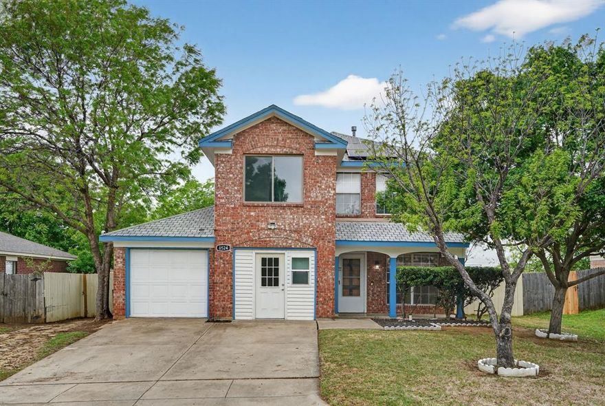 The home at 8524 Gatlinburg Dr is a two-story single-family house located in a quiet neighborhood in south Fort Worth. Built in the mid-1990s, it has about 1,600+ square feet of space with three bedrooms and around two to two-and-a-half bathrooms. The layout is simple and practical, with the living room and kitchen downstairs and all bedrooms upstairs for privacy. There is also a second living area or loft upstairs that can be used as an office or extra space. The kitchen is updated with modern features, and the main bedroom includes a walk-in closet and a private bathroom. Outside, the home has a brick exterior, a two-car garage, and a fenced backyard with a small patio. It sits on a typical suburban lot and is part of a car-dependent area served by local schools in the Crowley school district.