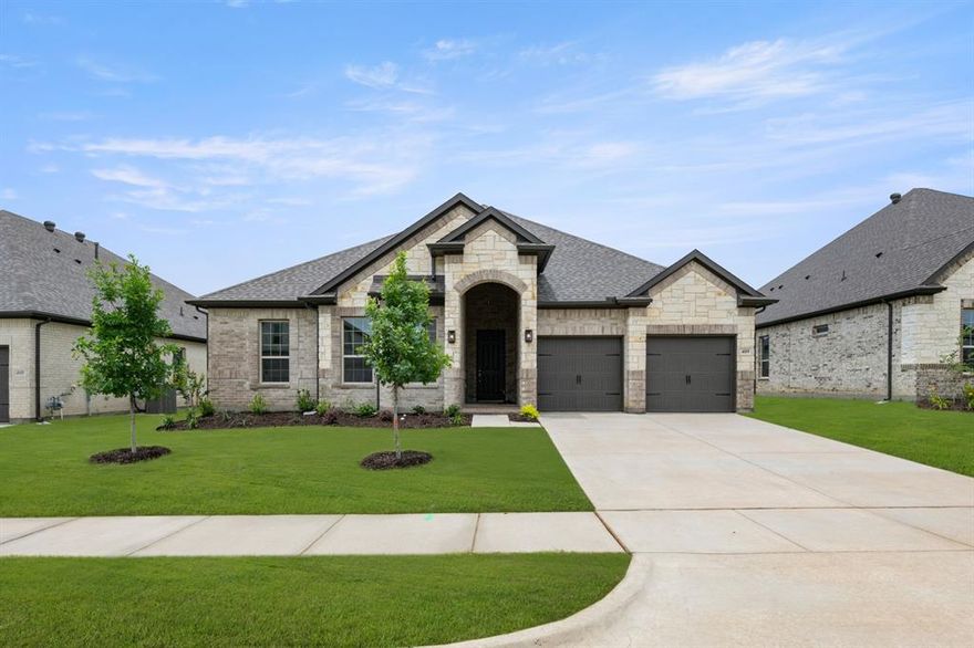 MLS# 21238911 - Built by Sandlin Homes - Ready Now! ~ Our Westwood plan with 4 bedrooms, 2.5 bathrooms, a barrel ceiling entryway, oven tower, fireplace, covered patio and a 2-car garage. This home is designed with 3cm quartz countertops, white painted cabinets, carpet, upgraded tile and laminate flooring, upgraded lighting, upgraded wall tiles and a tiled fireplace.