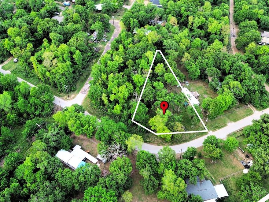 Positioned on a desirable corner lot in the peaceful community of Log Cabin Estates, this .20-acre property offers a rare opportunity to build with ease just minutes from Cedar Creek Lake. With city water and sewer already installed—a significant value and convenience—this lot is truly ready for your vision from day one. Electric is available at the street, making the building process even more seamless. Whether you're looking to place a mobile home, build a cozy residence, or secure a low-maintenance rental opportunity, the flexibility here is hard to find. Enjoy the benefits of quiet, community living with city-maintained roads and convenient access to a nearby boat dock less than half a mile away—perfect for those who want to spend their days on Cedar Creek Lake without the waterfront price tag. Located within reach of both Eustace ISD and Malakoff ISD, this property offers added versatility for buyers. Opportunities like this—where utilities are already in place, location is prime, and possibilities are wide open—don’t come around often. Come walk the property and start imagining what you can create here.