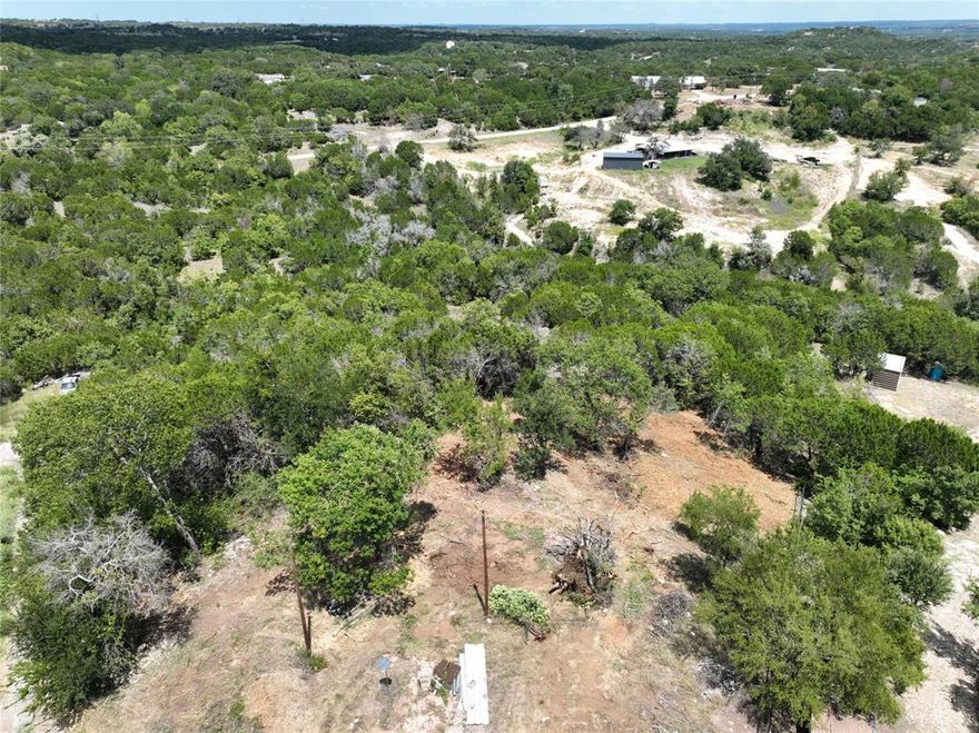 2.32 acres with a well and electricity. Options are endless!
