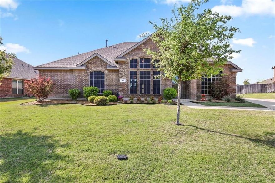 Step into the welcoming embrace of 405 Bardwell Way in Forney, Texas, a delightful 4-bedroom, 3-bathroom home nestled in the Villages of Fox Hollow. The interior exudes a timeless charm with a neutral color palette and rich hardwood floors that seamlessly flow throughout the residence. The bright entryway introduces the formal dining and living rooms, setting the stage for elegant gatherings. The open, eat-in kitchen is a culinary haven, featuring granite counters, a gas range, and a spacious island. The expansive primary retreat delights with vaulted ceilings and a versatile space for a sitting area overlooking the backyard. The en-suite bath is a sanctuary with dual vanities, a garden tub, and a separate shower. Two secondary bedrooms share a convenient jack-and-jill bath. Outside, the large backyard beckons for outdoor enjoyment, and a 2-car attached garage.